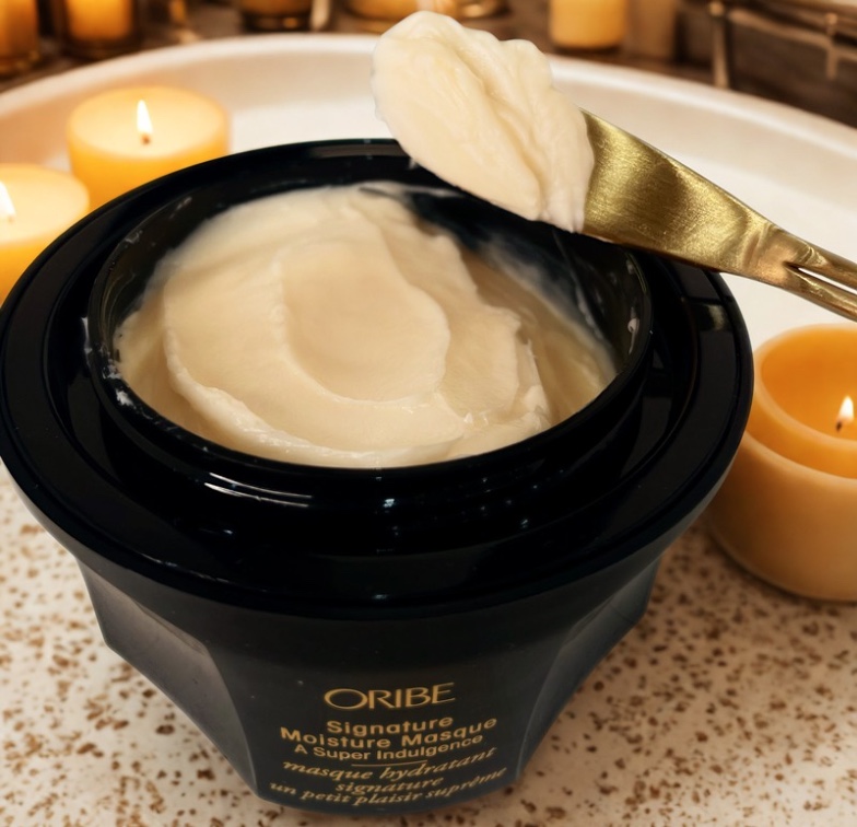 Oribe's Signature Moisture Masque and candles, great for luxury hair care at home